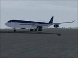 A LANChilie A340 sits in the rain. A Lot of the time you never see the parked planes fly, but it all adds to the realism